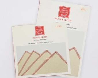 May include: Two sheets of Monk's Cloth fabric from The Oxford Company. The fabric is pre-cut and serged, with white lines every 5cm. The packaging includes the company logo and product details. The fabric is 100% cotton.