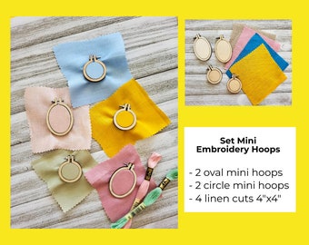 May include: Set of mini embroidery hoops with 2 oval hoops, 2 circle hoops, and 4 linen cuts, each measuring 4 inches by 4 inches. The hoops are displayed on squares of fabric in various colors, including blue, yellow, pink, and green.