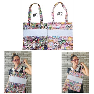 May include: Two colorful tote bags with a white panel in the middle. The bags are printed with a variety of cartoon characters and emojis. The bags are labeled #1 and #2.