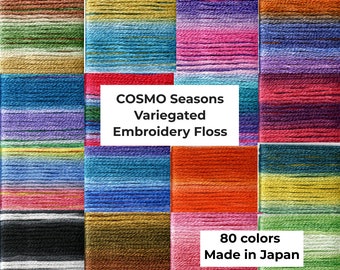 May include: A collection of 80 variegated embroidery floss skeins in a variety of colours. The floss is made in Japan and is labelled "COSMO Seasons Variegated Embroidery Floss".