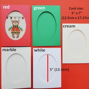 May include: Five blank greeting cards with oval cutouts. The cards are red, green, white, cream, and marble. The card size is 5 inches by 7 inches (12.5 cm by 17.17 cm).