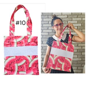 May include: A red and white tote bag with a watermelon print and a white stripe across the middle. The bag has two handles and the number #10 is printed on the front.