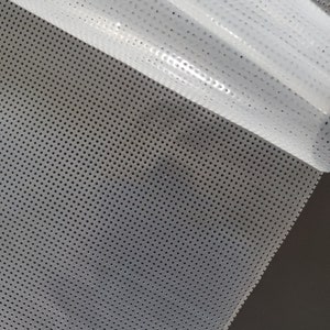 May include: White mesh fabric with a fine, evenly spaced pattern of small holes. The fabric is translucent and has a slightly glossy finish.