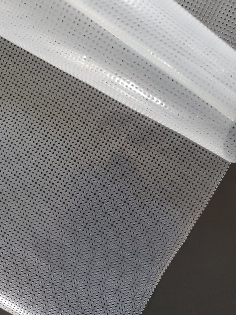 May include: White mesh fabric with a fine, evenly spaced pattern of small holes. The fabric is translucent and has a slightly glossy finish.
