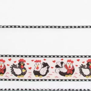 May include: White fabric with a decorative border featuring cartoon chickens and red hearts. The chickens have red combs and are in various poses. A black and white patterned trim borders the top and bottom.
