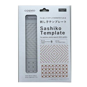 Könnte beinhalten: Eine Cosmo Sashiko-Schablone in weißer Verpackung mit schwarzem Text. Die Schablone zeigt ein Kaki-Blütenmuster und ein münzförmiges Muster. Die Verpackung enthält den Text Sashiko Template, For precise, evenly spaced stitch guides und Size: approx 13 x 18 cm.