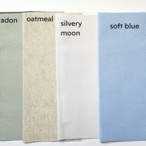 four fabric swatches, each with a different color: celadon, oatmeal, silvery moon, and soft blue.