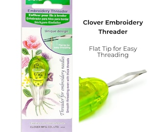 May include: A Clover Embroidery Threader with a unique design and flat tip for easy threading. The tool is neon green and white, with the text "Embroidery Threader" and "Flat Tip for Easy Threading" on the packaging.