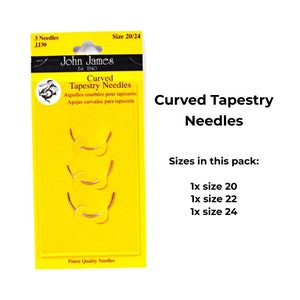 May include: A package of three curved tapestry needles in sizes 20, 22, and 24. The needles are displayed on a yellow background with the John James logo and the text "Curved Tapestry Needles".