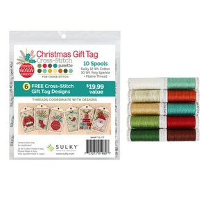 May include: A Christmas Gift Tag cross-stitch kit with 10 spools of thread. The kit includes 6 free gift tag designs. The thread colours include white, gold, green, and red. The packaging features a Christmas ornament design.