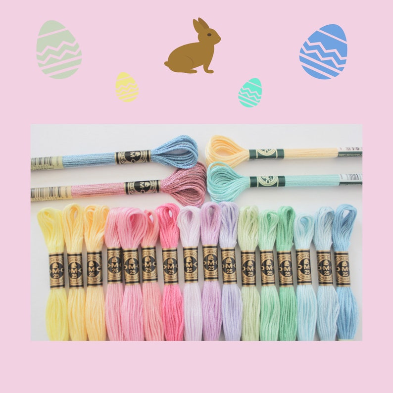 May include: A collection of colorful embroidery floss in various pastel shades, including yellow, pink, blue, and green. The floss is arranged on a white surface, with Easter-themed illustrations of eggs and a bunny in the background.