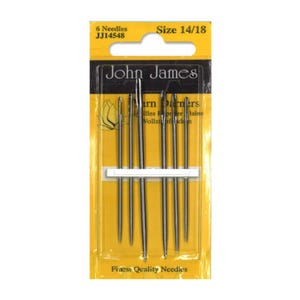 May include: A pack of six John James size 14/18 darning needles. The pack is yellow with black text and a white label. The needles are silver.