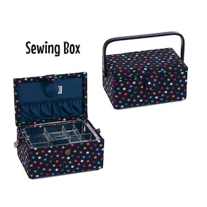 May include: A blue sewing box with a colorful star pattern and a clear lid. The box has compartments for organizing sewing supplies. The box is open and the lid is propped up.