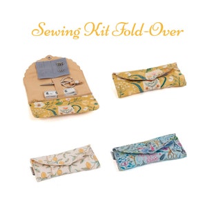 May include: A set of four sewing kits with fold-over closures. The kits are made of fabric with different floral and geometric patterns. The kits contain sewing needles, thread, scissors, and a tape measure.
