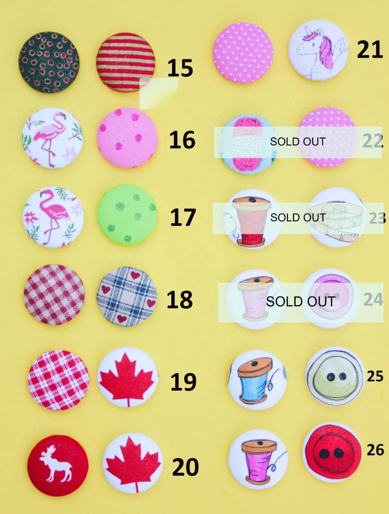 a collection of colorful buttons with various designs, including polka dots, stripes, and other patterns.