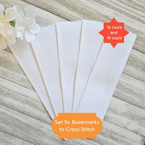 May include: Set of five white Aida cloth bookmarks for cross stitch. The bookmarks are 16 count and 18 count Aida cloth.