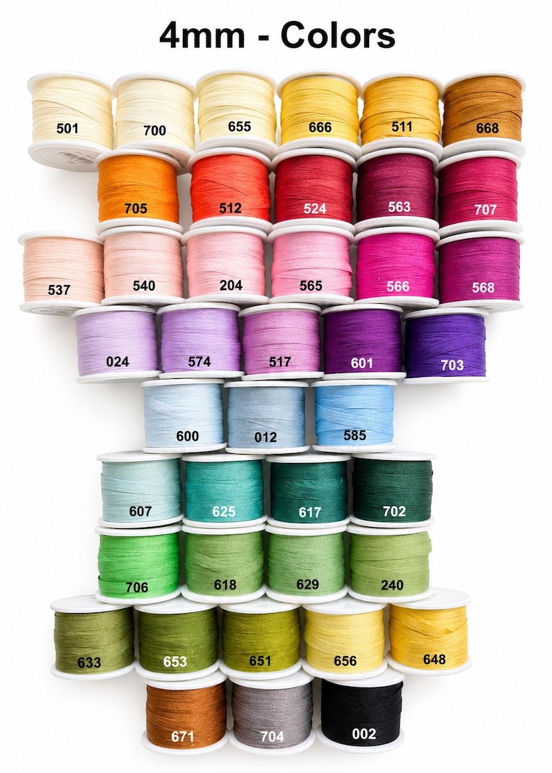 May include: A collection of 4mm spools of thread in various colors arranged in a grid. Each spool is labeled with a specific numerical code, including 501, 700, 655, 666, 511, 668, 705, 512, 524, 563, 707, 537, 540, 204, 565, 566, 568, 024, 574, 517, 601, 703, 600, 012, 585, 607, 625, 617, 702, 706, 618, 629, 240, 633, 653, 651, 656, 648, 671, 704, and 002.