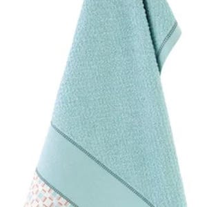 May include: A light blue hand towel hanging from a metal hook. The towel has a textured surface and a decorative band at the bottom with a geometric pattern in white, brown, and light blue. The towel is made of a soft material.
