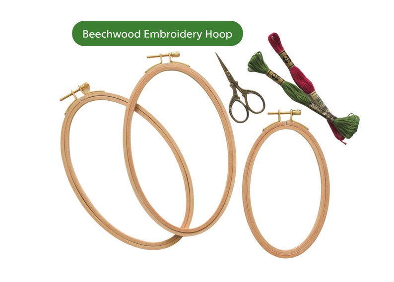 May include: Three wooden embroidery hoops of different sizes, with a pair of small scissors and two spools of embroidery floss in red and green.