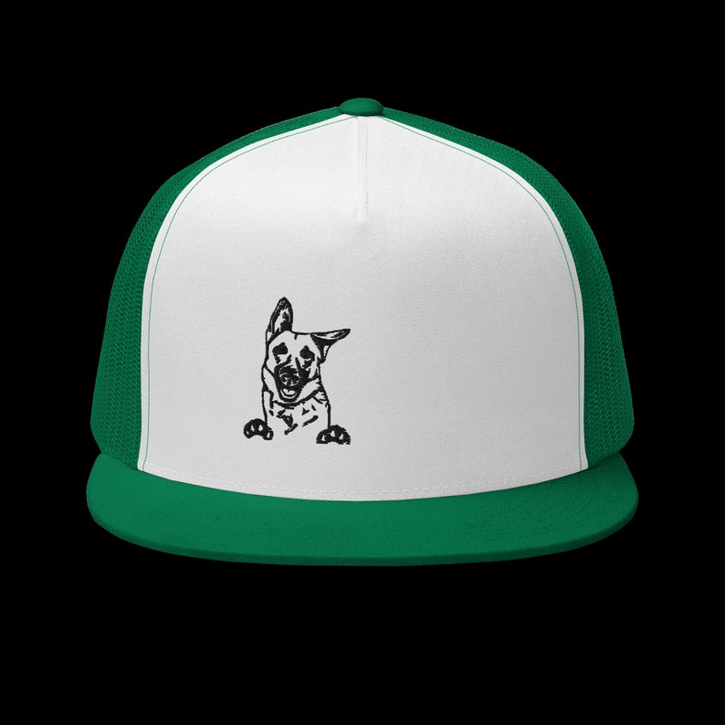 May include: A white and green trucker hat with a black and white illustration of a German Shepherd dog peeking out from behind the brim.
