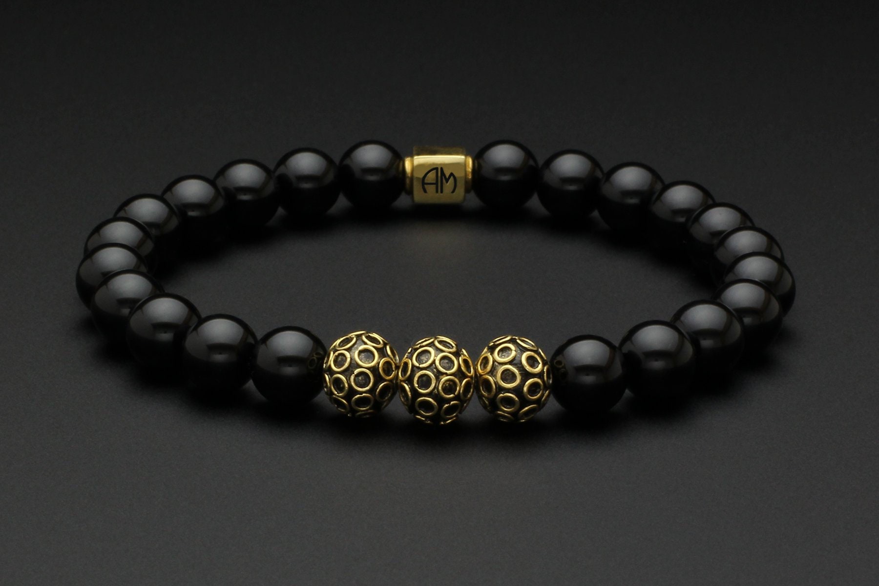 Mens gold and black onyx best sale bracelet