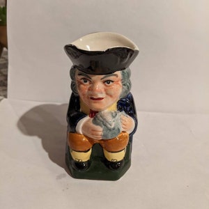 Rare short hat pearlware Toby jug with monogram "TB"