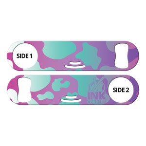 May include: A pink and blue camouflage patterned bottle opener with the text "SIDE 1" on one side and "SIDE 2" and the logo "INK CORRECT" on the other side.