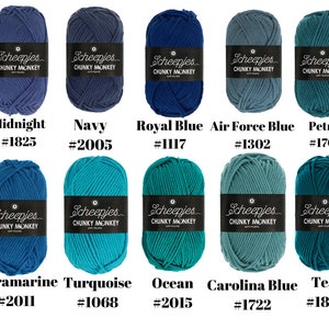 May include: Ten skeins of Scheepjes Chunky Monkey yarn in various shades of blue. The colors are Midnight, Navy, Royal Blue, Air Force Blue, Petrol, Ultramarine, Turquoise, Ocean, Carolina Blue, and Teal. Each skein has a label with the brand name and color number.