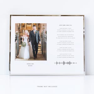 May include: A framed print featuring a wedding photo of a couple walking down an aisle. The print includes the names "Chloe & Luke" and the date "03.05.24" at the bottom left. Text and a sound wave graphic are on the right side. The frame is silver.