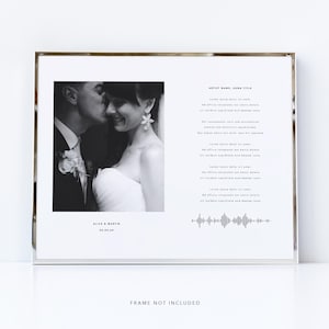 May include: A framed black and white photo print featuring a couple, with the groom kissing the bride's cheek. The print includes text: "ARTIST NAME, SONG TITLE," song lyrics, and a sound wave graphic. The names "ALICE & MARTIN" and the date "02.03.24" are also printed.