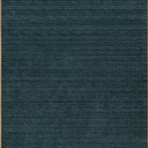 8x10 area rug in dark forest green. The solid color rug is handknotted in high quality NZ wool.