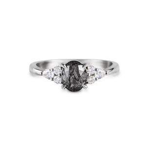 Bespoke 1.25ct oval salt and pepper diamonds engagement ring with trefoil shoulders, platinum