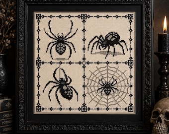 May include: A square cross-stitch embroidery framed in black, featuring four distinct panels. Each panel displays a black spider or web design stitched onto a light beige fabric background, separated by a black geometric border pattern.