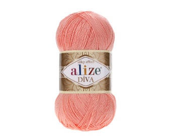 May include: A ball of peach-colored yarn with the label "alize silky effect DIVA" on it.