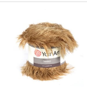 May include: A skein of brown faux fur yarn called "Tango" by Yarn Art.
