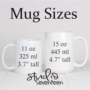 May include: Two white ceramic mugs with black text showing the size and volume of each mug. The smaller mug is 11 oz (325 ml) and 3.7" tall. The larger mug is 15 oz (445 ml) and 4.7" tall. The text "Mug Sizes" is at the top of the image. The text "studio Seventeen" is at the bottom of the image.