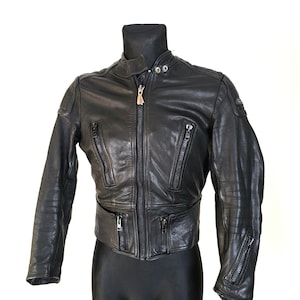 May include: Black leather motorcycle jacket with a zipper closure and multiple pockets.