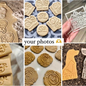 May include: A selection of cookie cutters and stamped biscuits. The cutters are made of clear plastic and feature various designs, including an octopus, a dog, a cat, and a mountain range. The stamped biscuits are made of dough and feature various designs, including "Order Sellars", "Partyon", and a fire hydrant.