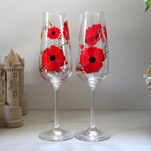 Hand painted crystal champagne flutes with a country poppy theme, lovely gift for a wedding anniversary