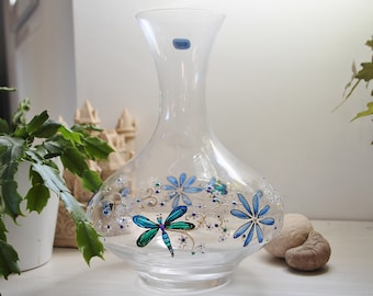 Pretty crystal carafe hand painted in blue tones and decorated with ladybugs and dragonflies fluttering among the flowers