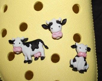 crocs with cows on them