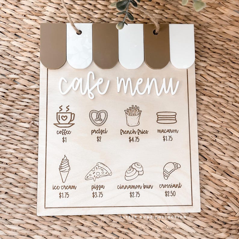 May include: Wooden cafe menu sign with a brown and white awning design. The menu features illustrations of coffee, pretzels, french fries, macarons, ice cream, pizza, cinnamon buns, and croissants.