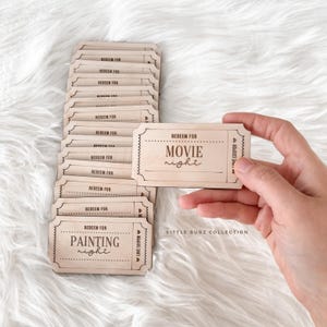 May include: A collection of light brown redeemable coupons with a vintage design. One coupon says "REDEEM FOR MOVIE night" and another says "REDEEM FOR PAINTING night". The text "LITTLE BUGZ COLLECTION" is also visible.