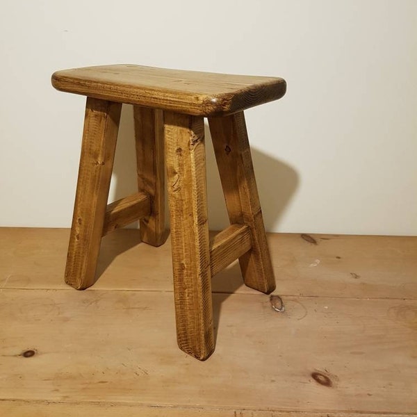 Rustic wooden milking stool