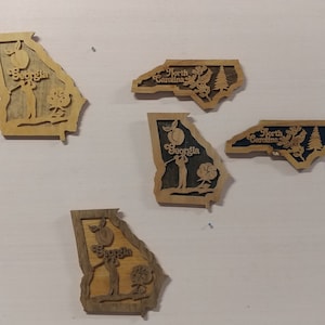 Unique wood art wall decor.  States handcut in wood with scroll saw.