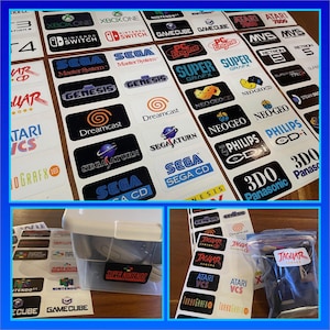 May include: A collection of vintage video game console stickers featuring logos for systems like Atari, Sega, Nintendo, and Super Nintendo. The stickers are arranged in rows on a white background.