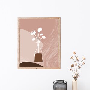 May include: A digital art print featuring a white line drawing of a vase with flowers on a pink and brown abstract background.
