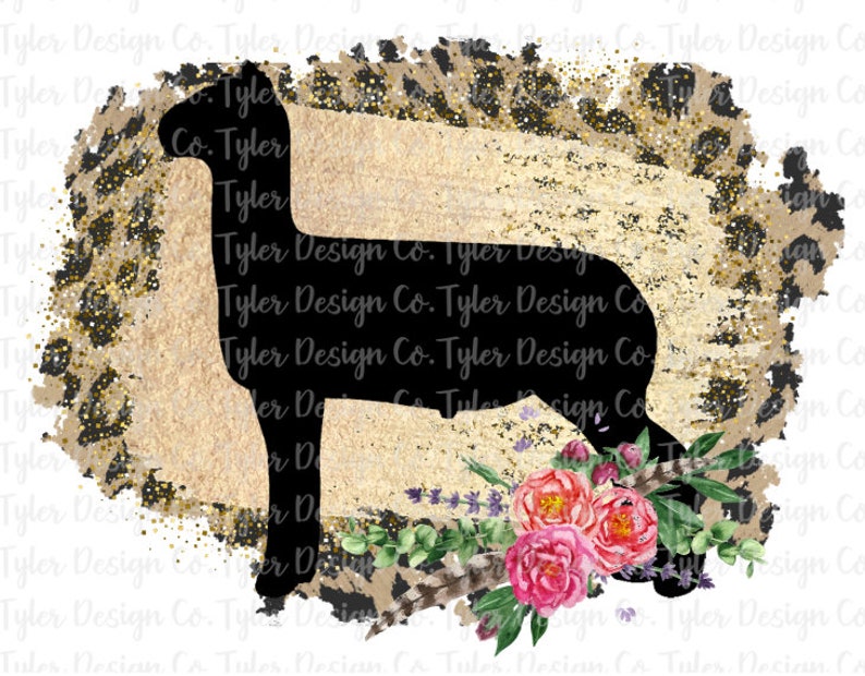 May include: Black silhouette of a cow with a floral design and gold glitter background. The floral design includes pink roses, green leaves, and lavender.