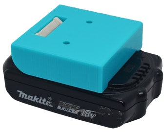 May include: A turquoise blue 3D printed battery cover for a Makita 18V 1.5Ah lithium-ion battery.