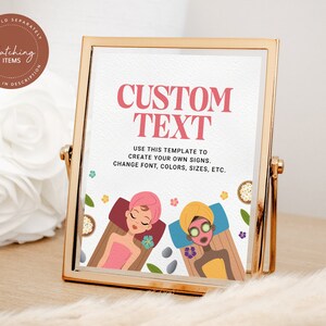 Op de afbeelding: Een gouden lijst met een witte achtergrond en de tekst "CUSTOM TEXT" in roze en zwart. De tekst eronder luidt "USE THIS TEMPLATE TO CREATE YOUR OWN SIGNS. CHANGE FONT, COLORS, SIZES, ETC." Het bord toont een illustratie van twee vrouwen die spabehandelingen krijgen.